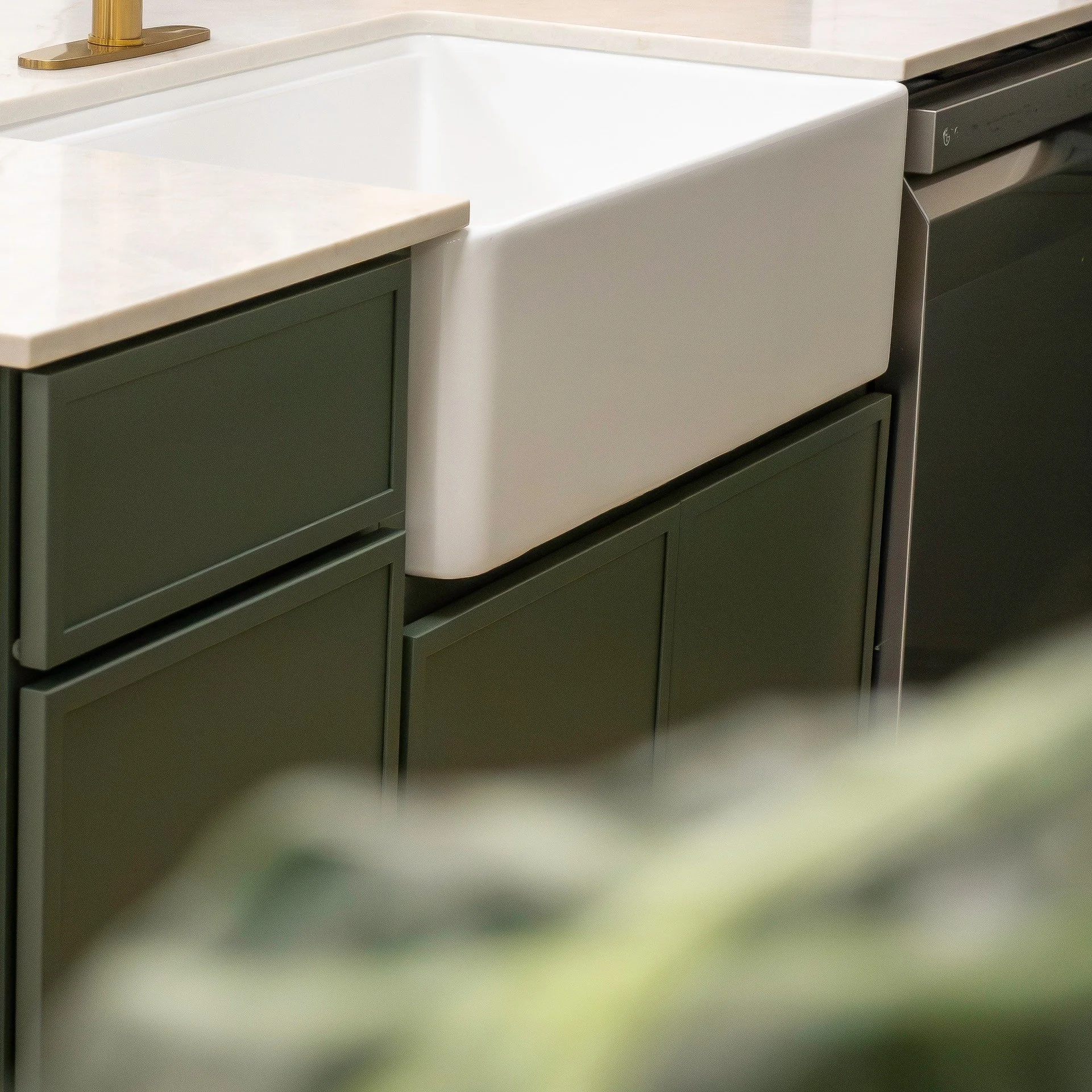 Be honest, did you scroll past or did you stop? There's something about deep, moody cabinets paired with a bright white farmhouse sink that just works. Classic but not safe. Clean but not cold.

Which would you choose for your kitchen:
A) Sage green 