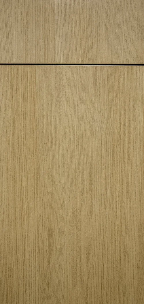 A close-up of a wooden cabinet door with a horizontal gap at the top, showing a natural wood grain pattern.
