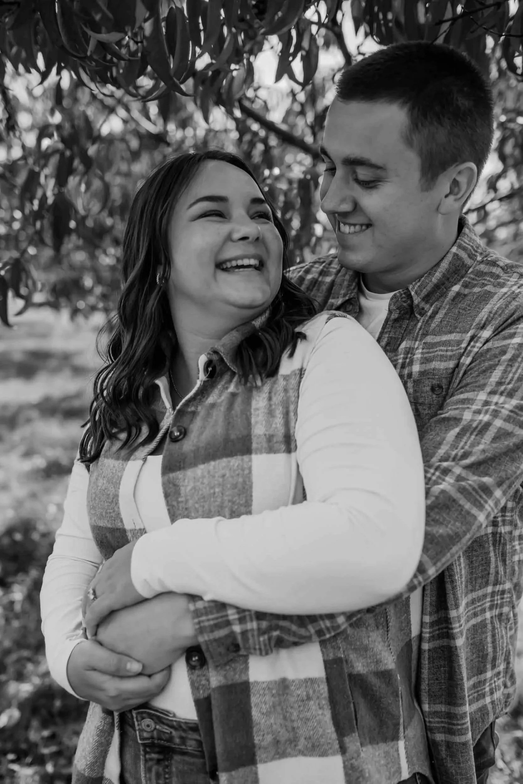 newly engaged couple at Breeden's Apple Orchard in Mount Juliet celebrate their surprise fall proposal