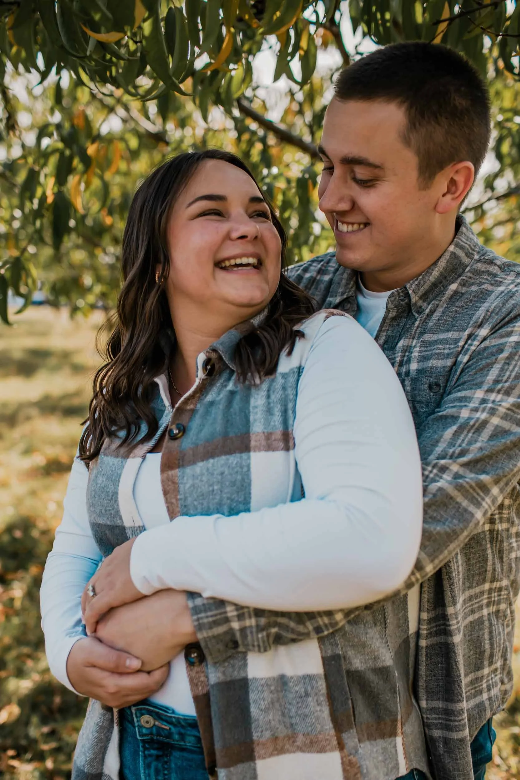 newly engaged couple at Breeden's Apple Orchard in Mount Juliet celebrate their surprise fall proposal