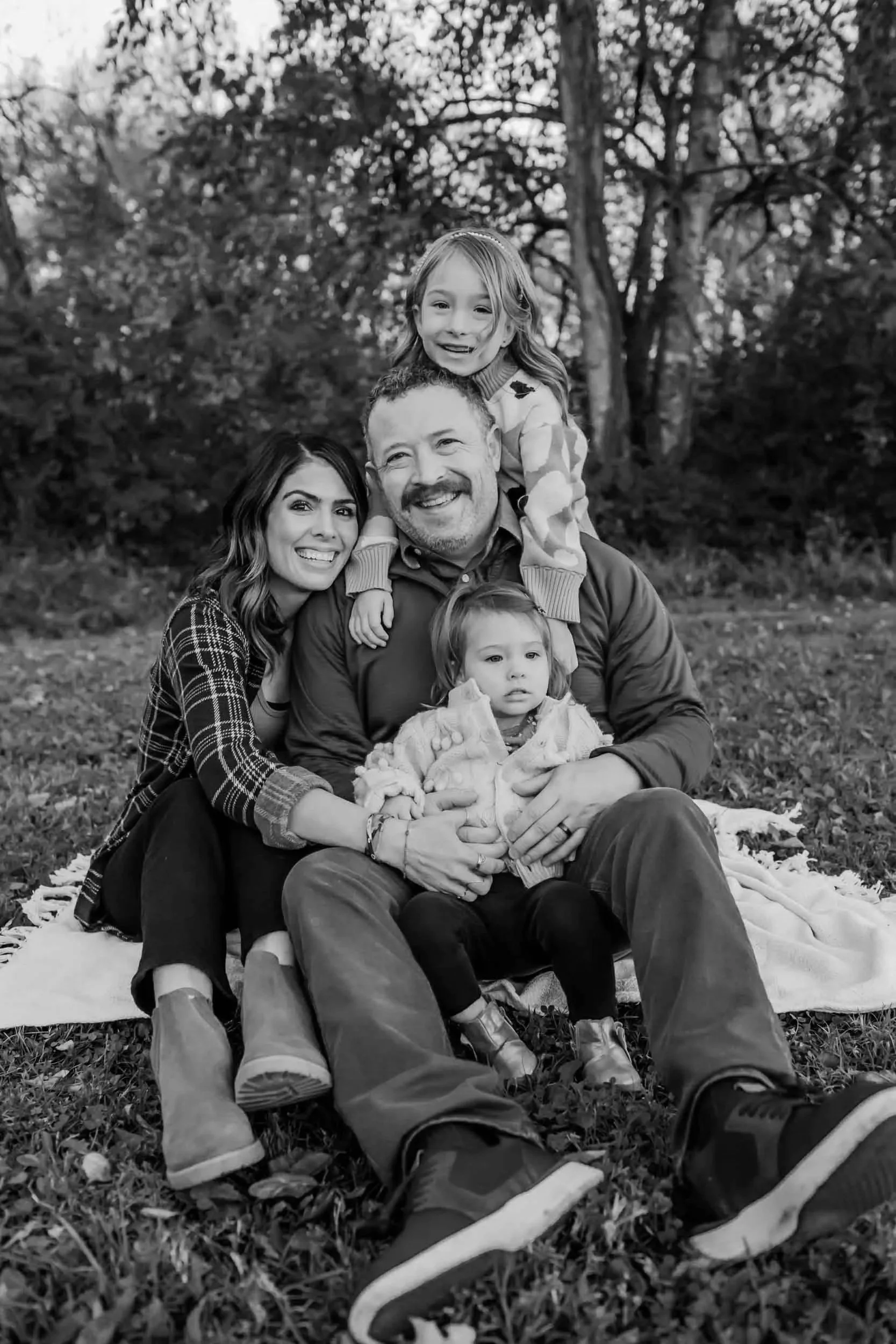 Mt Juliet Family sitting on the ground snuggling and smiling