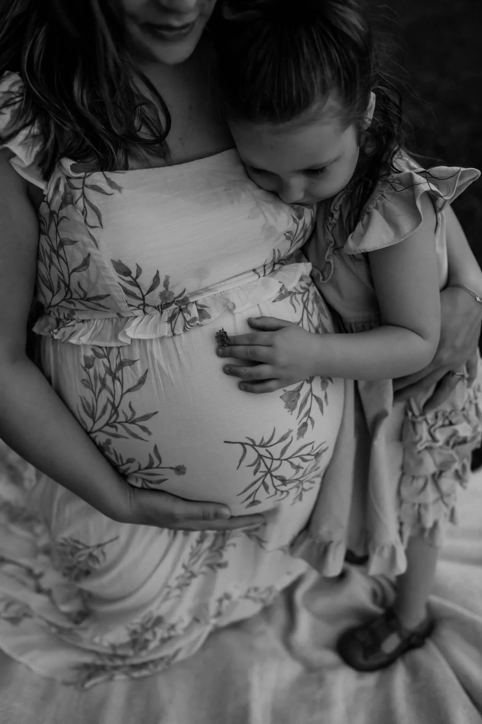 Mt Juliet Maternity Photo of a daughter hugging her mother's pregnant baby bump