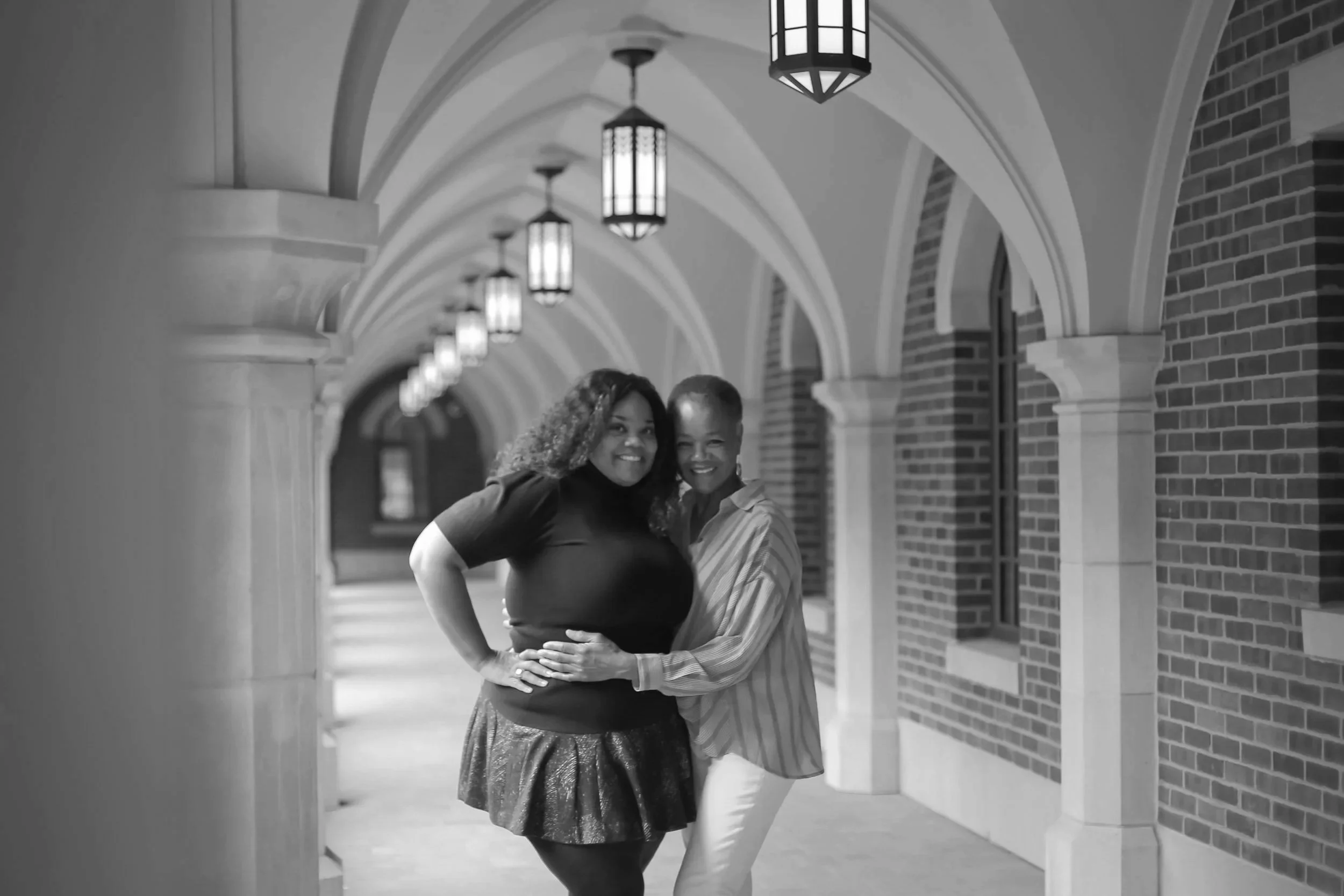 Adult woman and mom pose lovingly for family photos at Vanderbilt University