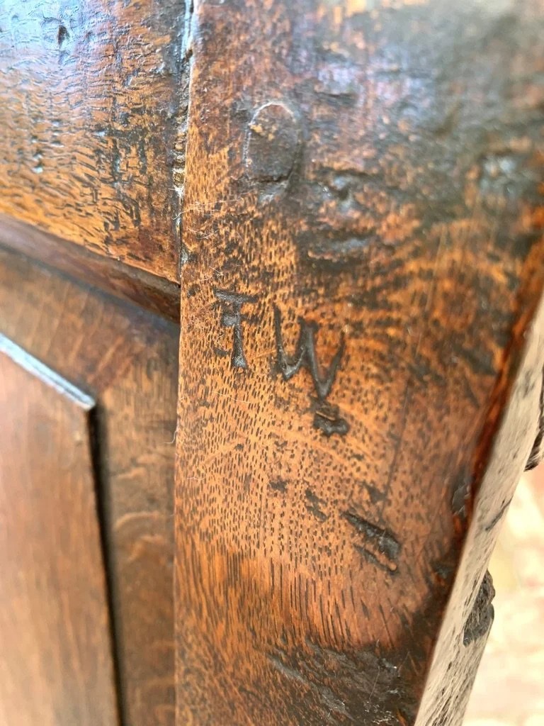 Original ownership brand mark T.W. on 17th century English oak box settle stile