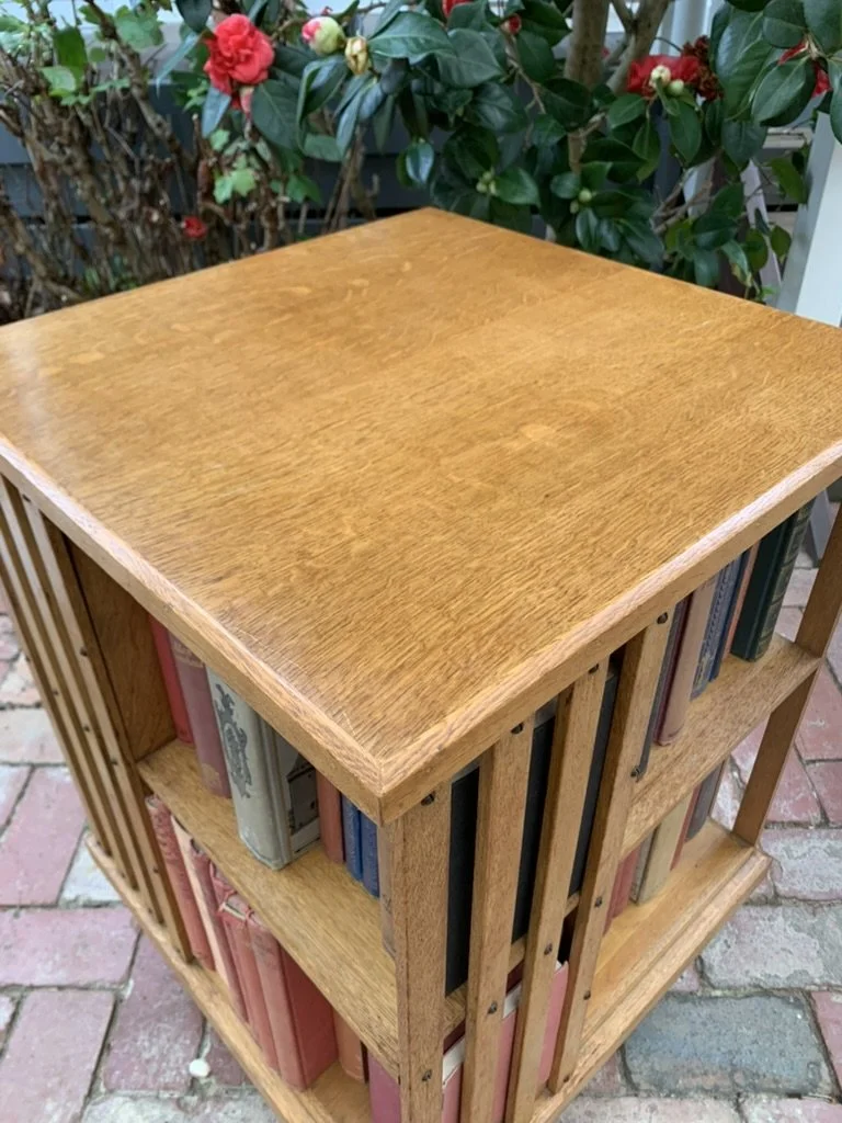 Quarter-sawn oak top of antique revolving bookcase showing fine grain and patina, C.1910 English piece