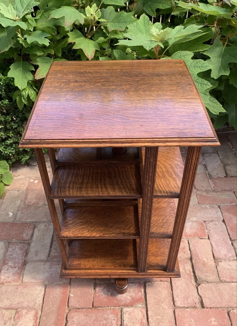 English oak revolving bookcase c.1910 showing empty shelves and prominent ray-figure quartersawn oak grain
