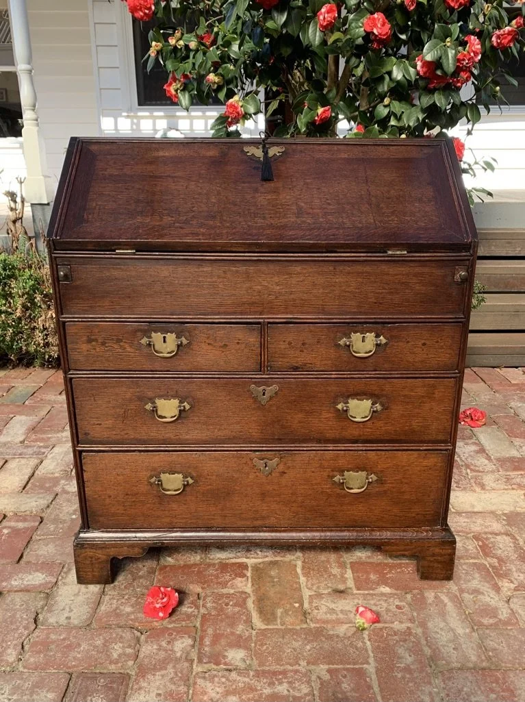 front on shot of georgian oak bureau on bracket feet when closed