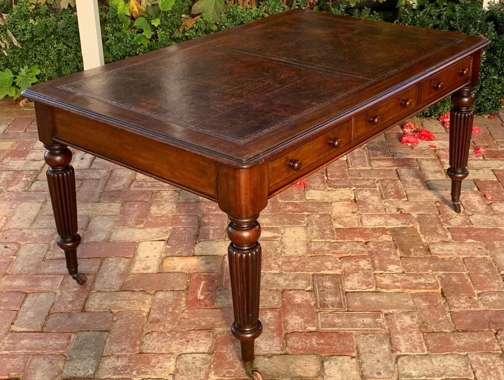 Victorian mahogany library writing table reeded tapered legs brass castors c.1850–1860