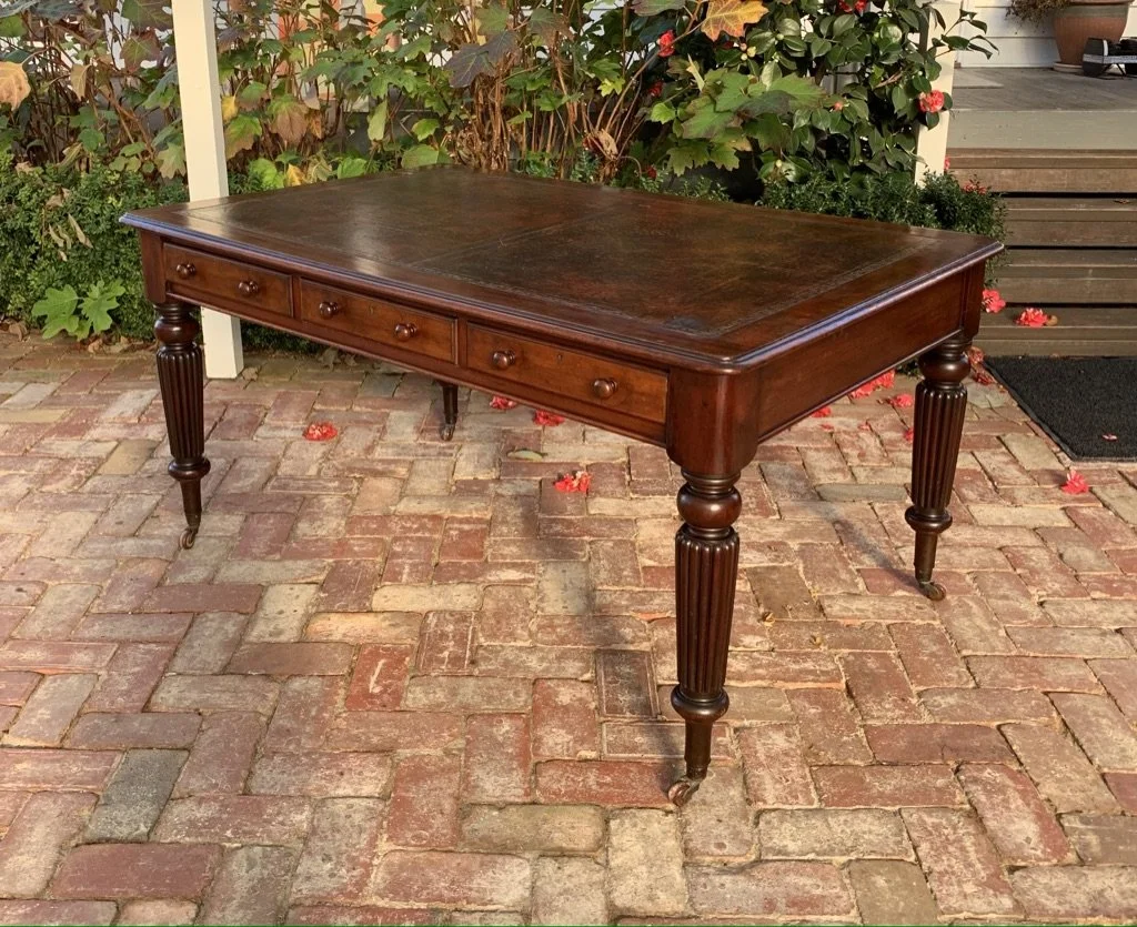 Victorian mahogany library table c.1850 three drawers each side reeded legs brass castors
