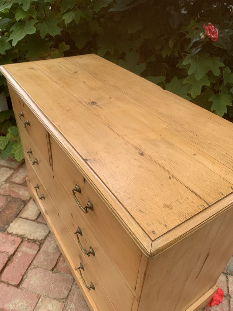 Close-up hand-cut moulded edge Georgian pine chest top corner detail