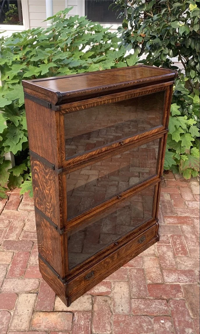 Antique Globe Wernicke three-section quartersawn oak barrister's bookcase base drawer brass handles English c.1910