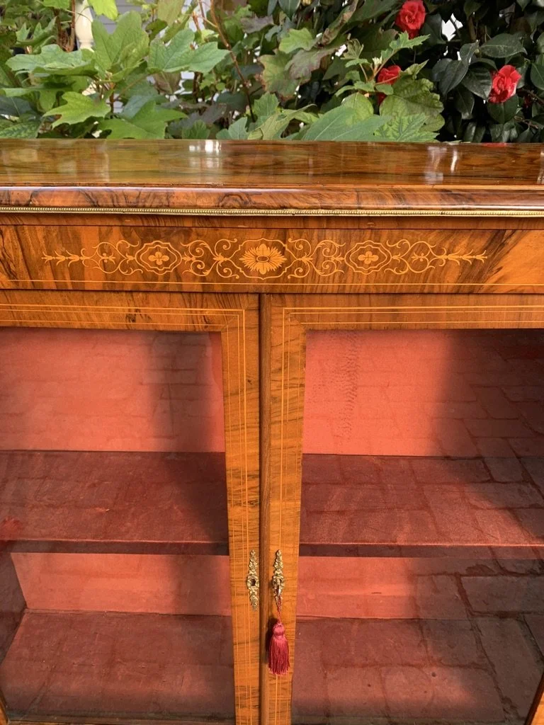 Victorian figured walnut pier cabinet with glazed double doors single shelf and ormolu mounts