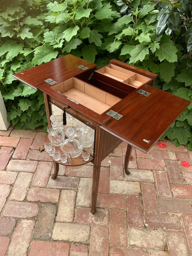 Edwardian mahogany drinks cabinet C.1900, flap top open, swivel mirrored decanter stand and glasses, antique spirit cabinet