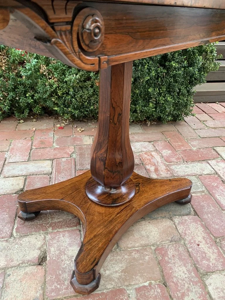 close up of faceted baluster column of rosewood fold over card table