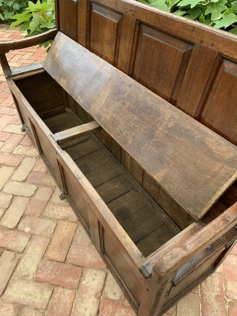 Deep storage compartment interior antique English oak box settle lift-up seat open