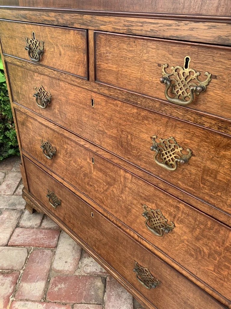 Close detail period brass fretwork bail handles figured oak drawer fronts Georgian chest drawers c.1790