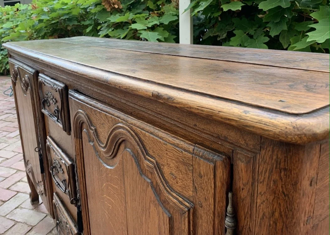 French oak enfilade top detail showing aged plank surface and moulded edge, c.1750–1800