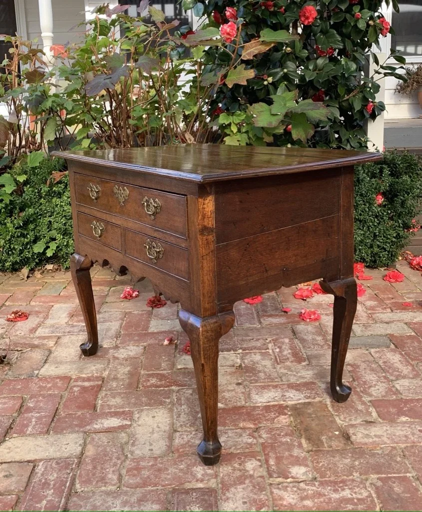 George II oak lowboy c.1740, cabriole legs with pad feet, scalloped apron — side and corner detail