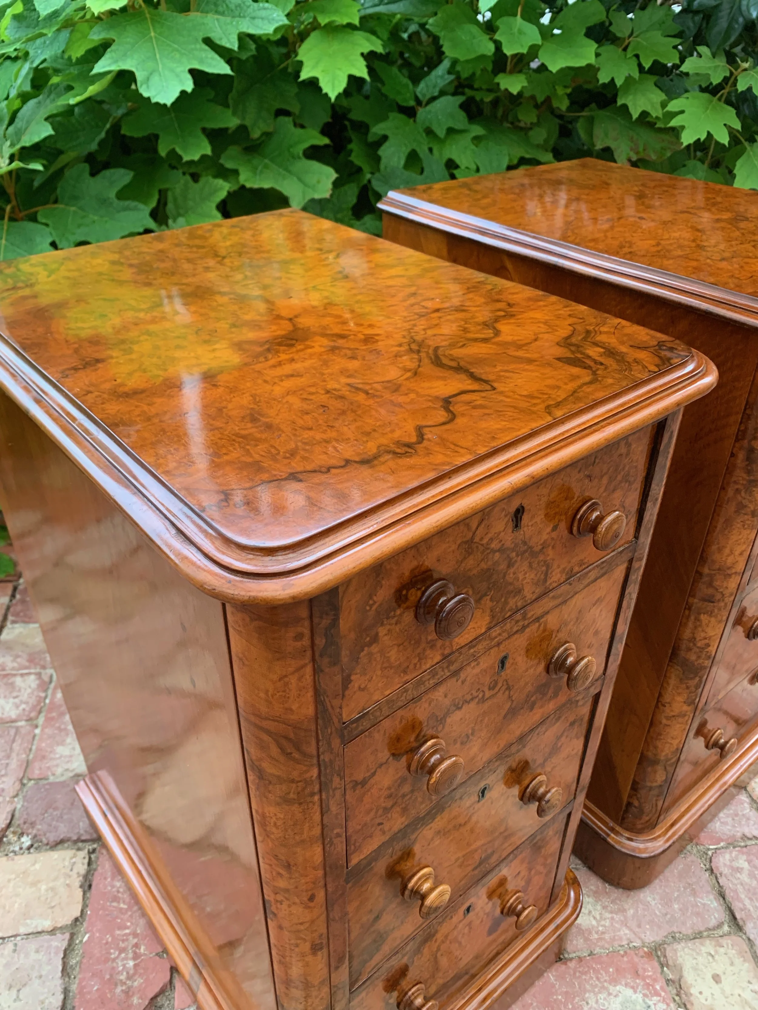 view of top of left hand chest of pair of victorian antique burr walnut bedside chests with graduating drawers and turned knobs circa 1870 