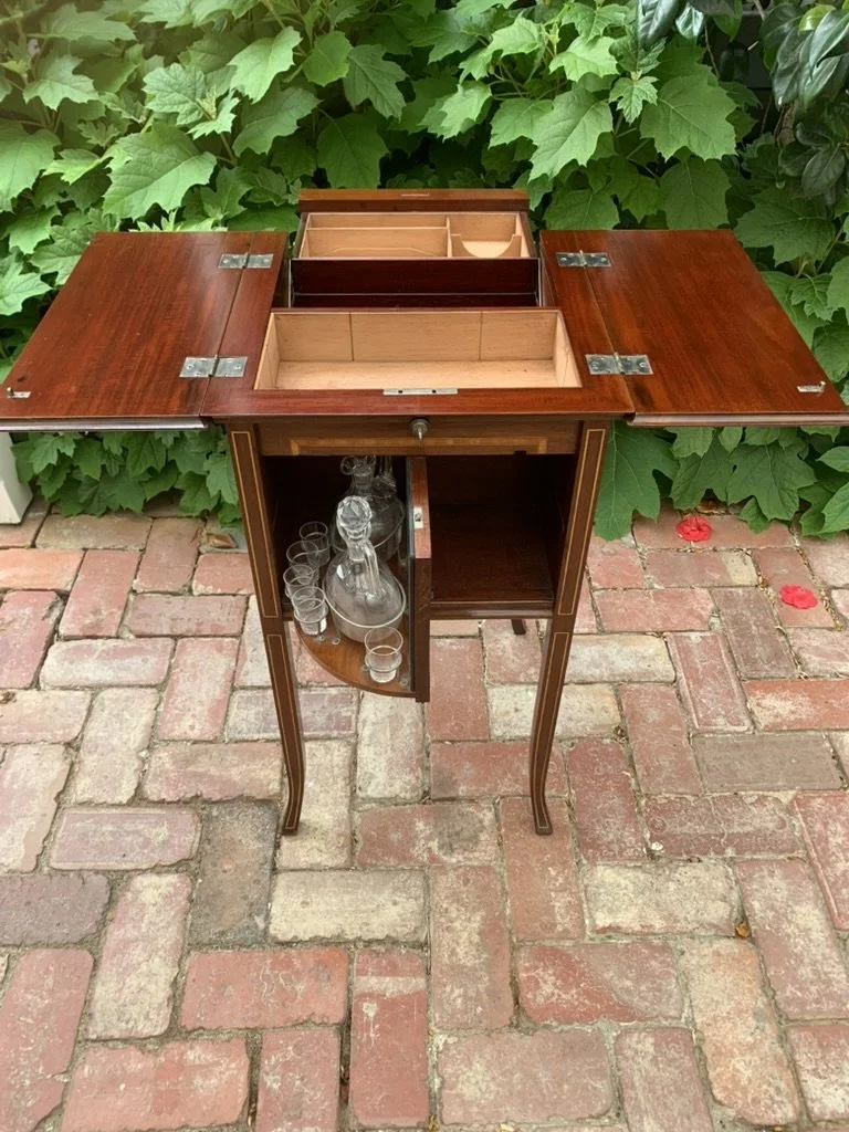 Edwardian mahogany drinks cabinet C.1900, flap top open, swivel mirrored decanter stand and glasses, antique spirit cabinet