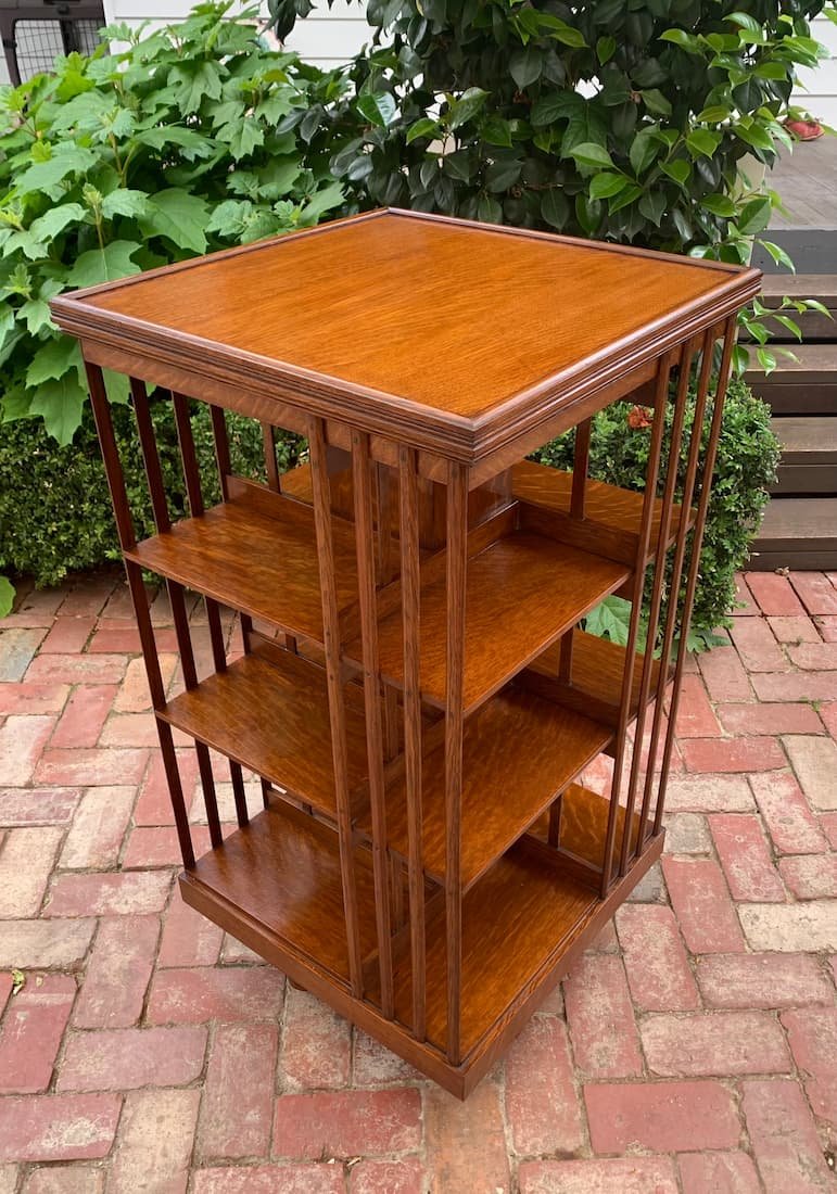 C.1890 antique quartersawn oak revolving bookcase, late Victorian rotating book stand with figured oak top and moulded edge