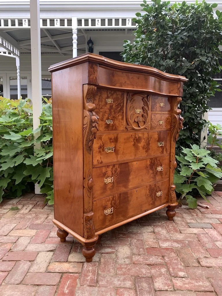 Antique Huon pine chest of drawers side view serpentine top carved decoration