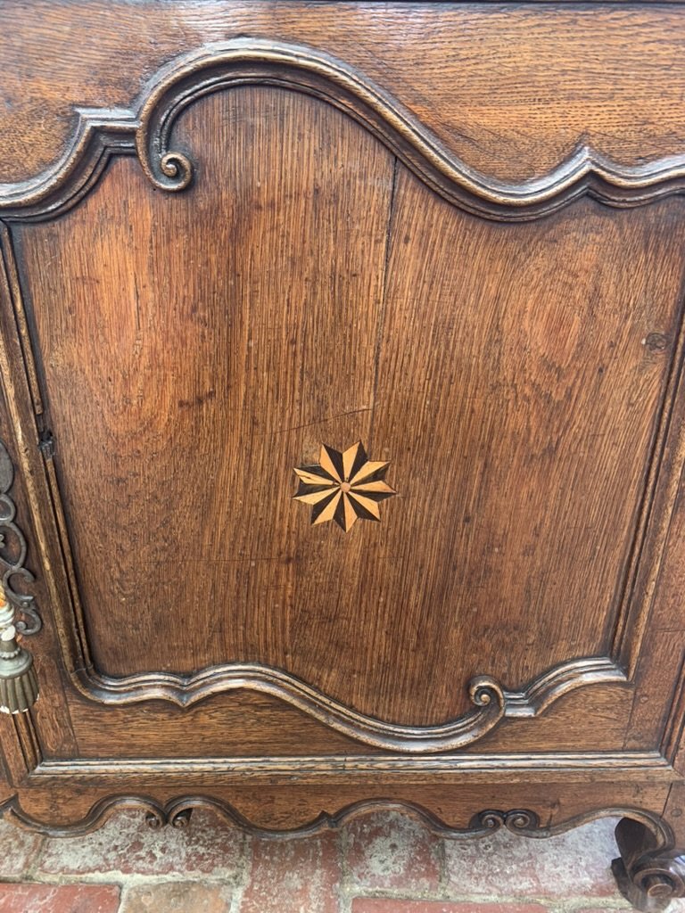 Star parquetry inlay detail on French oak buffet door panel, 18th century Breton cabinetry