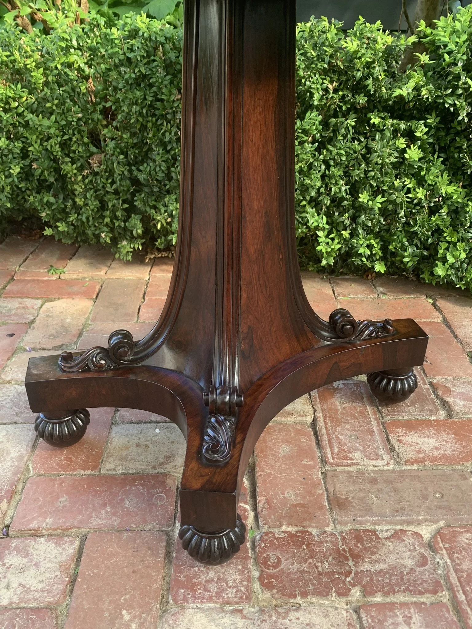 Carved scroll supports and turned feet on William IV card table base