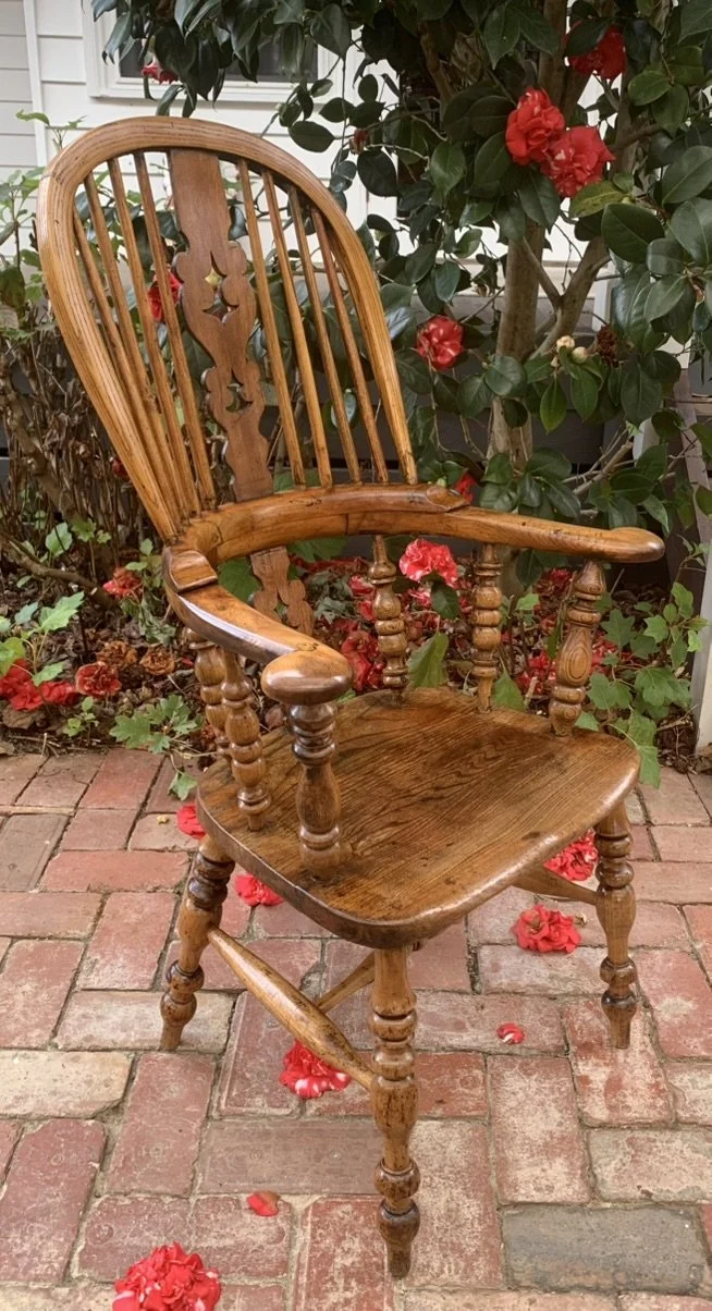 Three-quarter view of antique oak and elm Windsor armchair, generous seat, golden oak patina