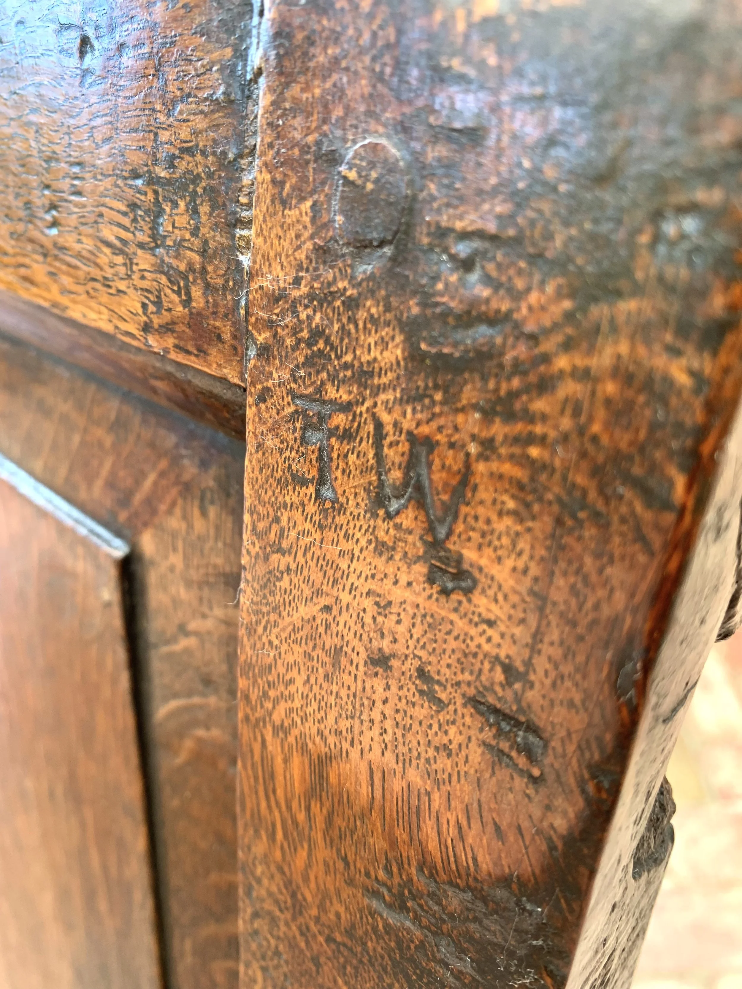 close of of ownership brand "T.W" on antique welsh oak box settle 