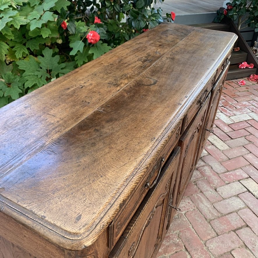 Weathered oak top corner detail showing rich mellow patina, French enfilade c.1740-1760