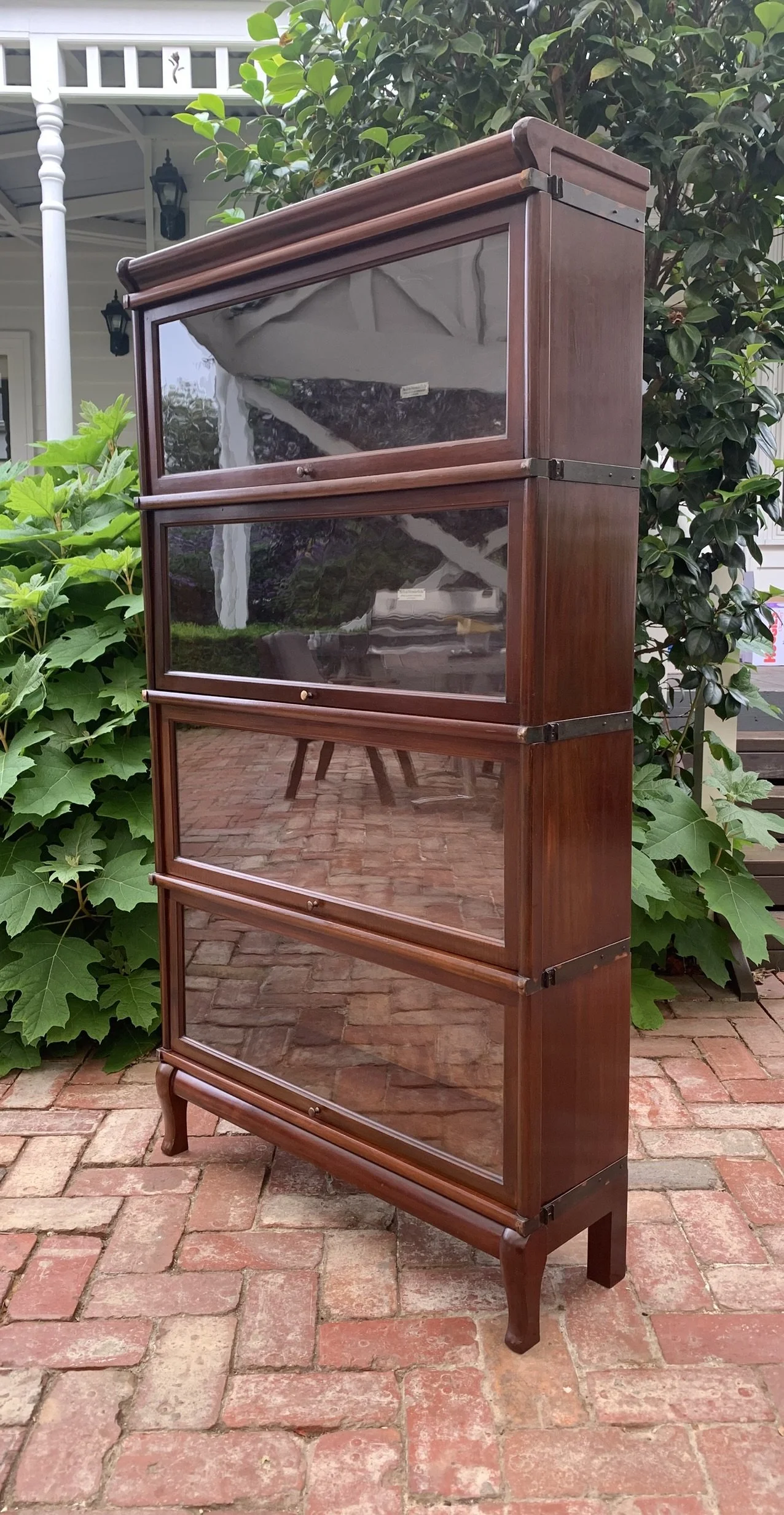 Profile view of 4 tier stackable mahogany lawyers bookcase