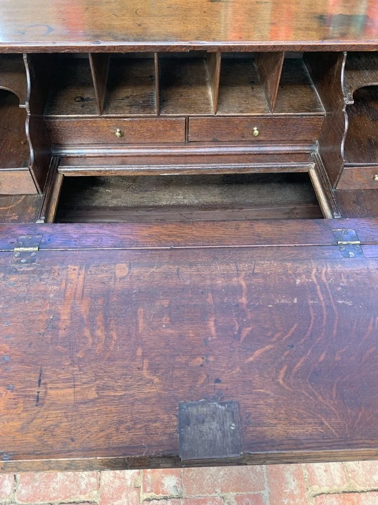close up of georgian oak bureau with fitted interior and sliding well