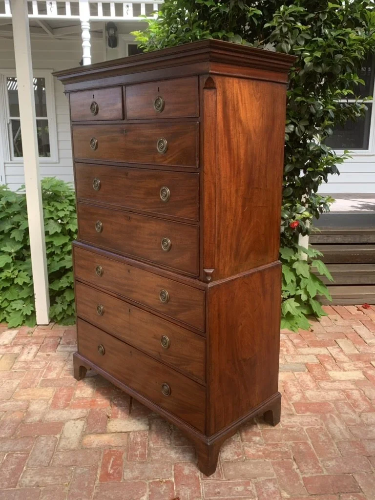 George III mahogany tallboy C.1790-1810, canted corners, moulded waist and flame mahogany side panel, bracket feet