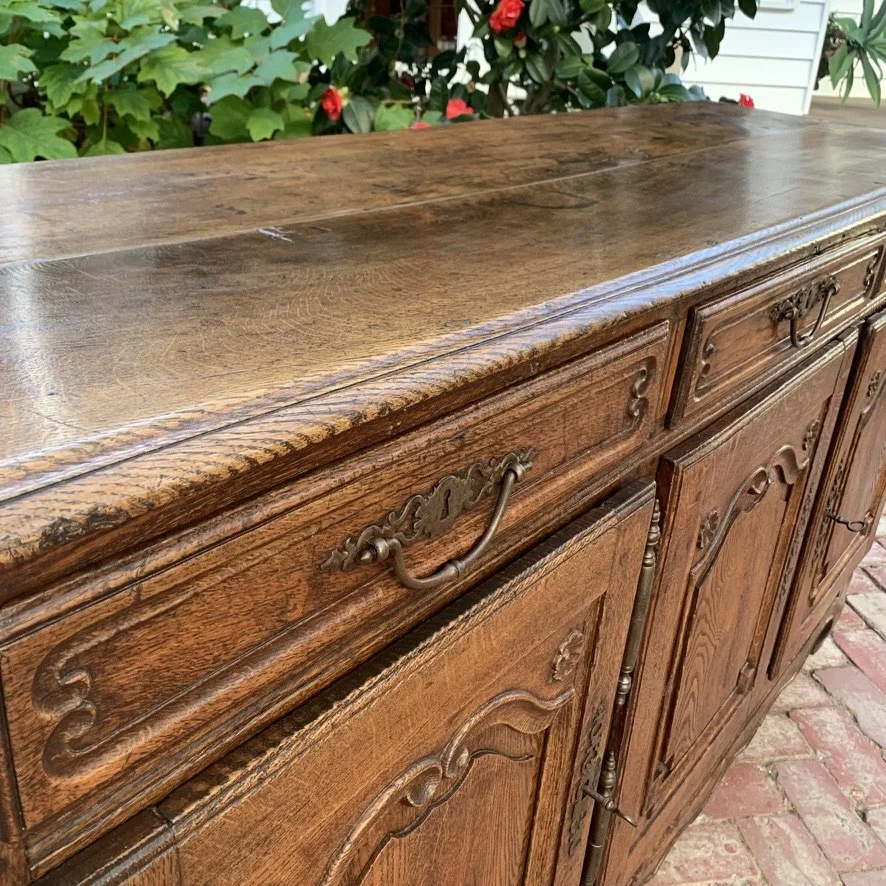 Reeded drawer fronts and carved door panels on antique French oak enfilade, Breton provincial