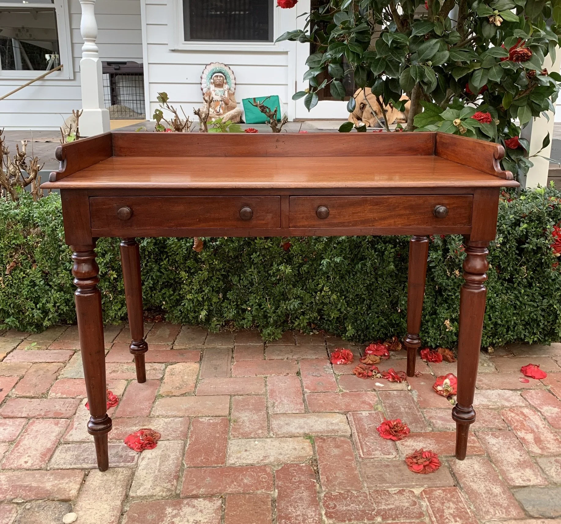 Antique English mahogany writing table, two drawers, turned tapered legs, Victorian C.1870