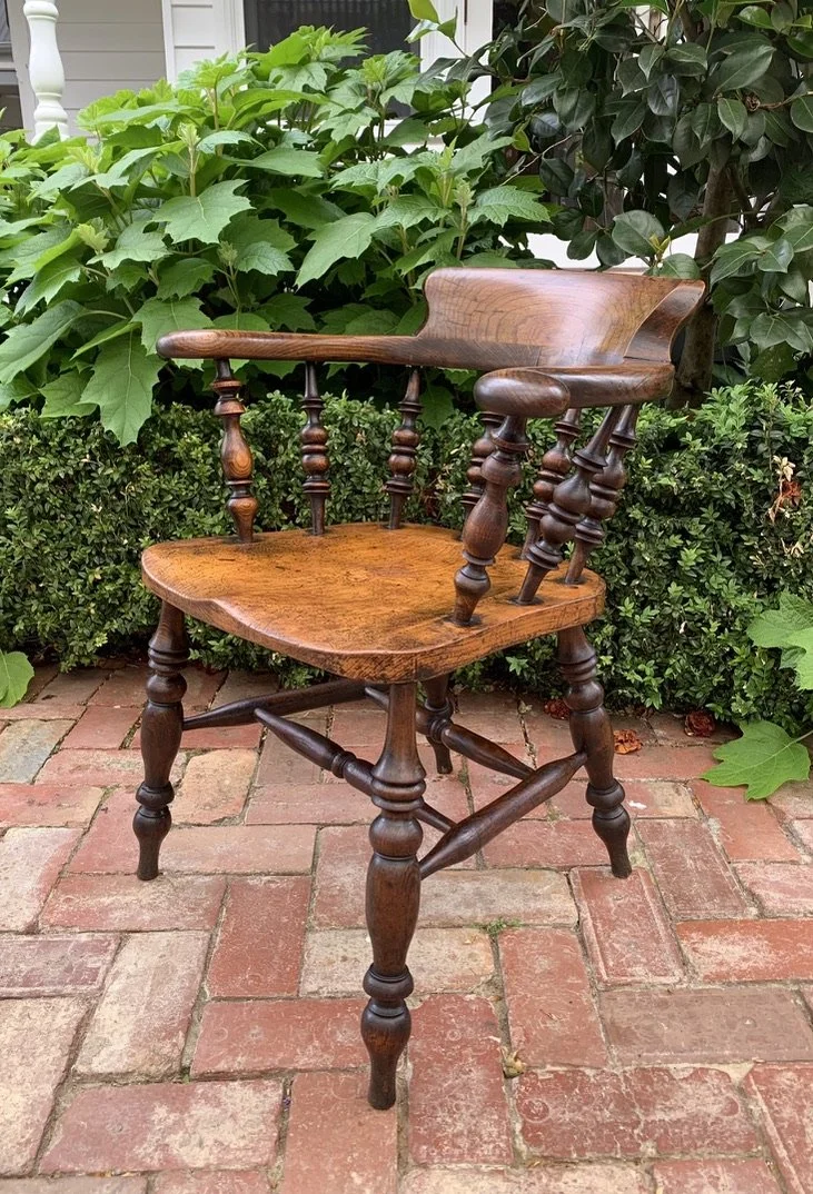 Victorian-era elm smoker's bow captain's chair with double stretcher base, antique pub chair form