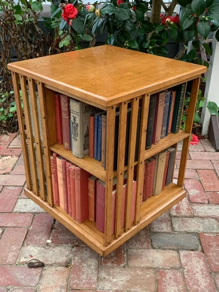 Antique oak revolving bookcase c.1910 with vintage books, English Edwardian library bookcase on castors