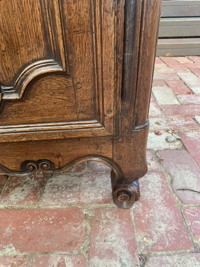 Cabriole leg and scroll foot detail on 18th century French oak enfilade sideboard