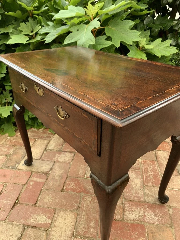angled view of georgian oak side table or lowboy top half