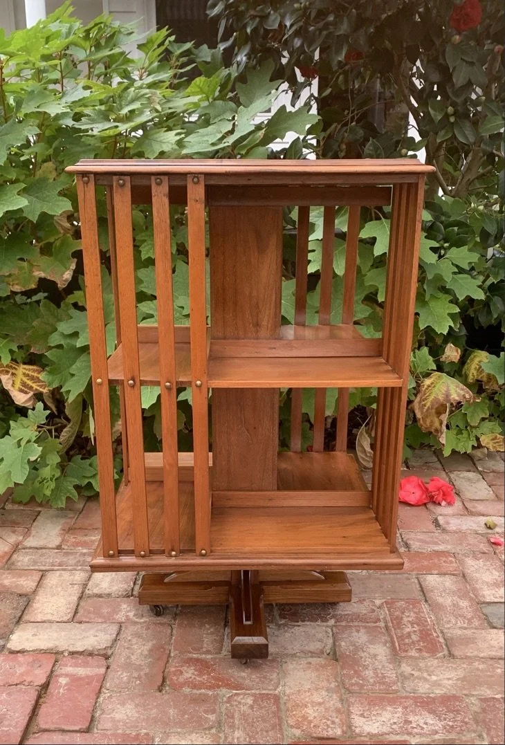 Edwardian revolving bookcase walnut c.1910 empty shelves cruciform base castors