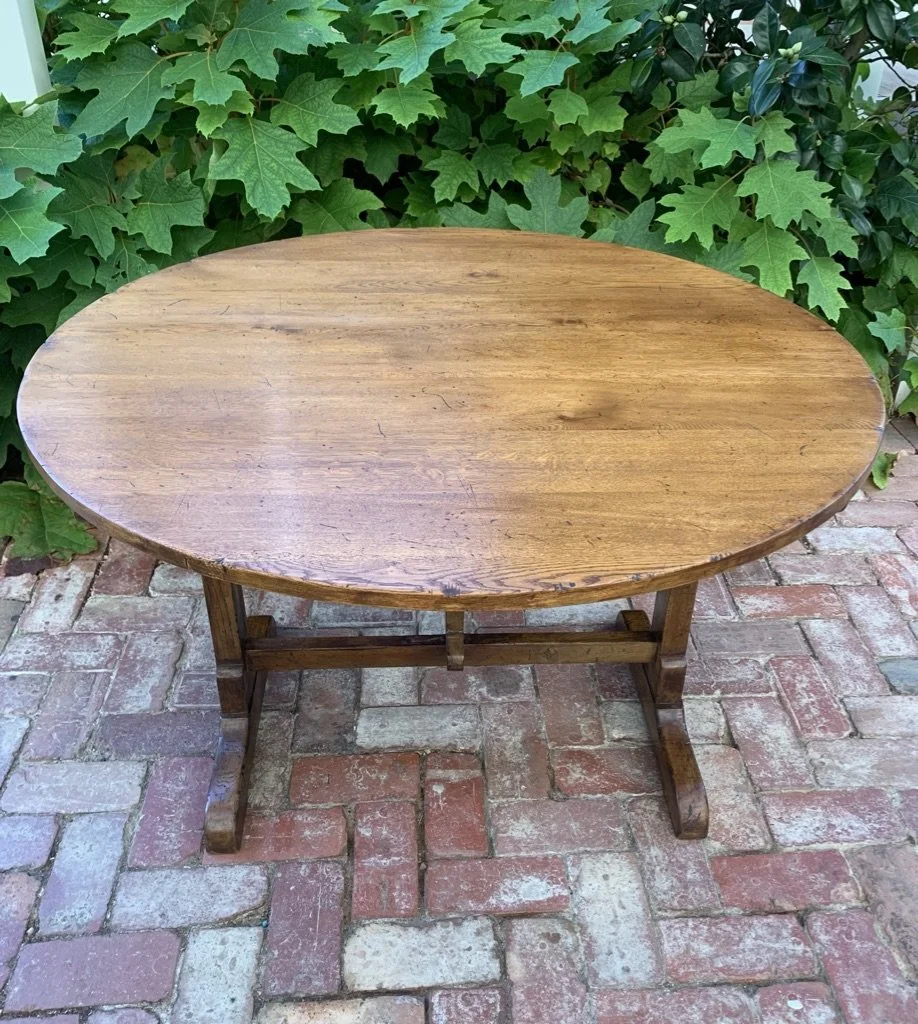 Overhead view French oak vendange table c.1930, oval planked top showing knots and original patina