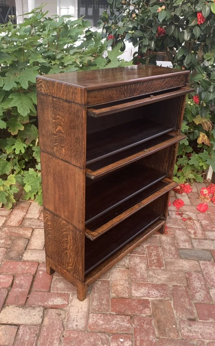 English oak barrister bookcase with all three glass fronts open, sliding glass doors and internal shelves
