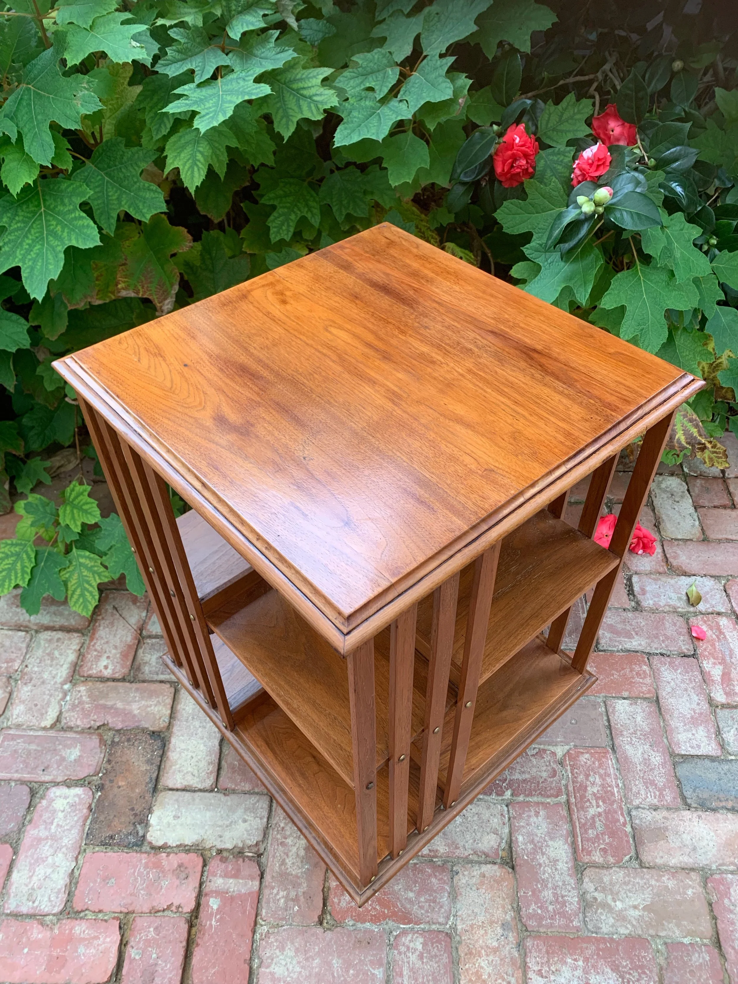Moulded walnut top Edwardian revolving bookcase c.1910 canted corners close-up