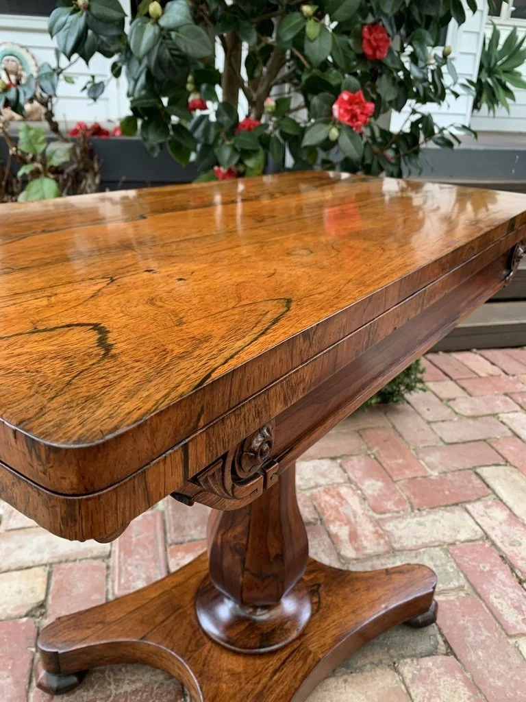 William IV rosewood card table with baize lined interior, baluster faceted column and quadriform platform base C.1835
