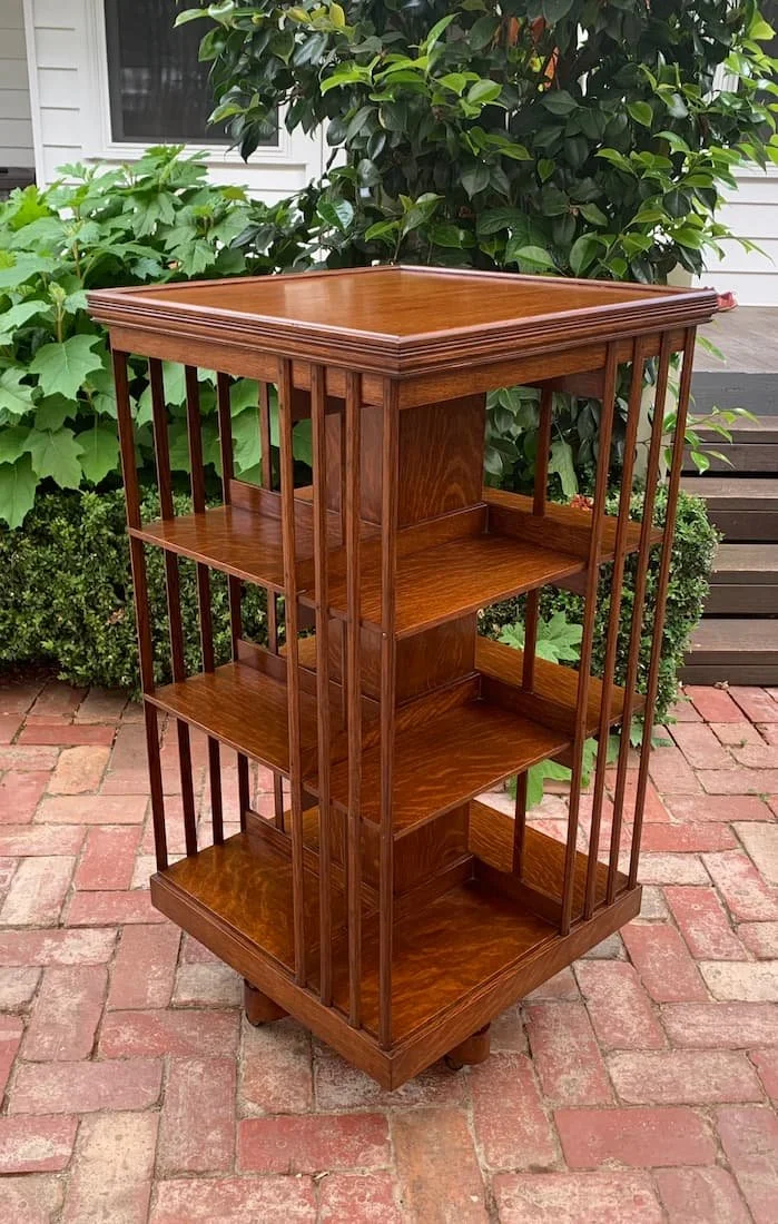 Late 19th century C.1890 oak revolving bookcase, large three tier rotating bookcase with slatted sides, library furniture
