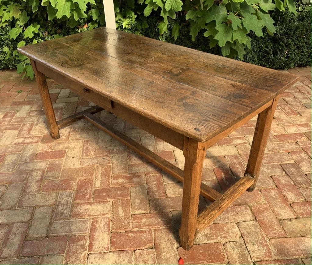 Early 19th-century French oak dining table — three-quarter view showing full form and country provenance