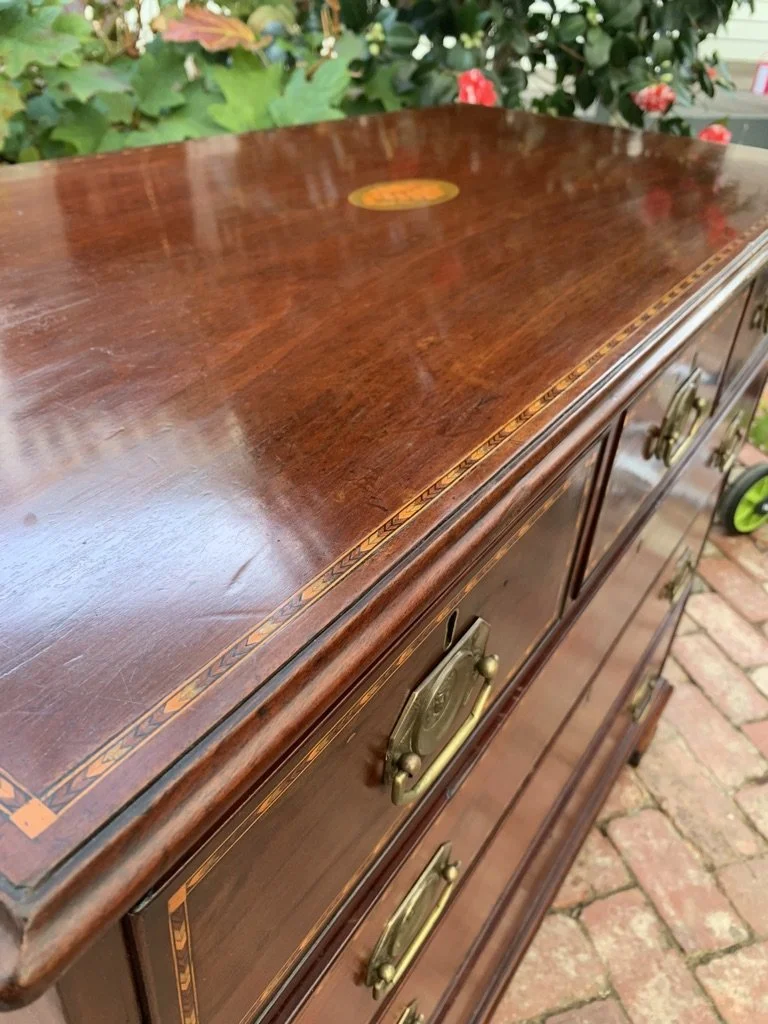close up view of top showing chevron inlaid border