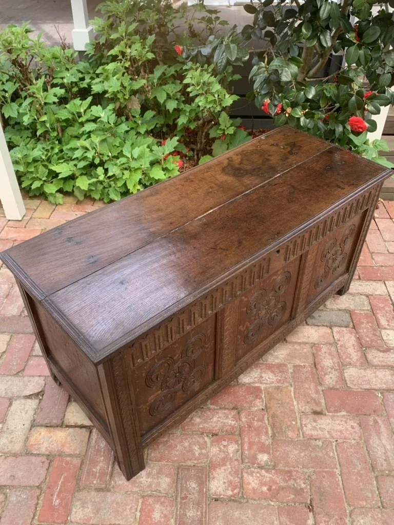 Antique oak blanket chest C.1680-1720, late 17th century English oak coffer with panelled end, carved front, stile feet