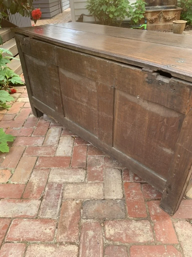 Rear of antique oak coffer C.1680-1720, panelled back with replacement iron hinges, early English oak blanket chest